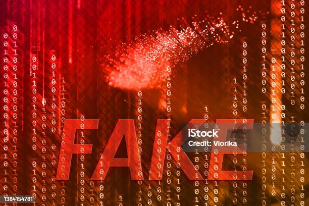Fake On A Binary Code Background Stock Photo - Download Image Now - Misinformation, Dishonesty, The Media
