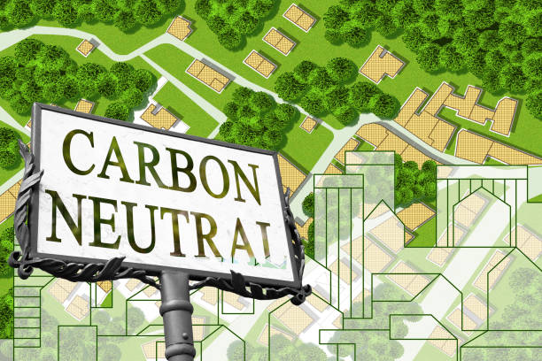 istock Carbon Footprint in the construction industry - Carbon Neutral concept with an imaginary cityscape and city map 1384154783