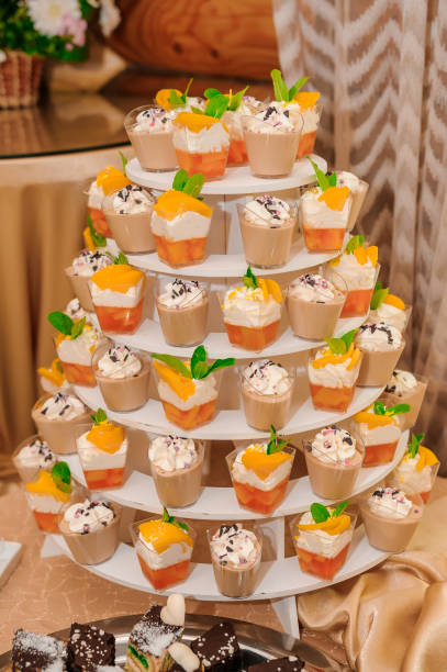 istock Sweet cakes in cups at a wedding buffet. Candy bar catering 1384157853
