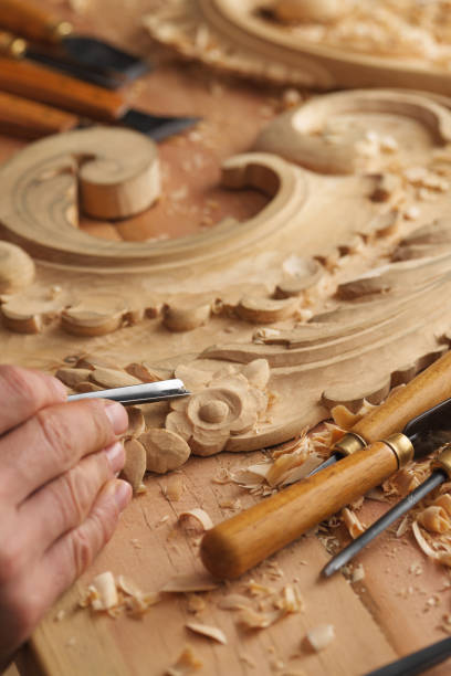 istock Man working with woodcarving instruments 1384160016