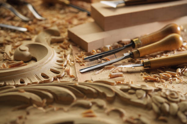 Carving wood with chisel. Carpenter's hands use chiesel Woodworking tools. Carving wood with chisel. Carpenter's hands use chiesel plane hand tool stock pictures, royalty-free photos & images