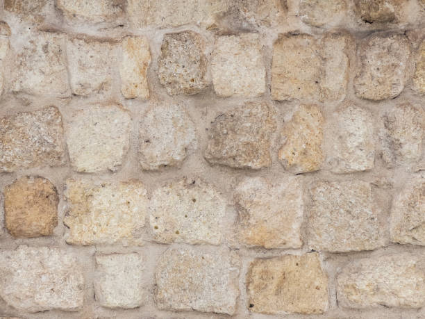 istock Wall decoration in natural yellow stone. 1384170918