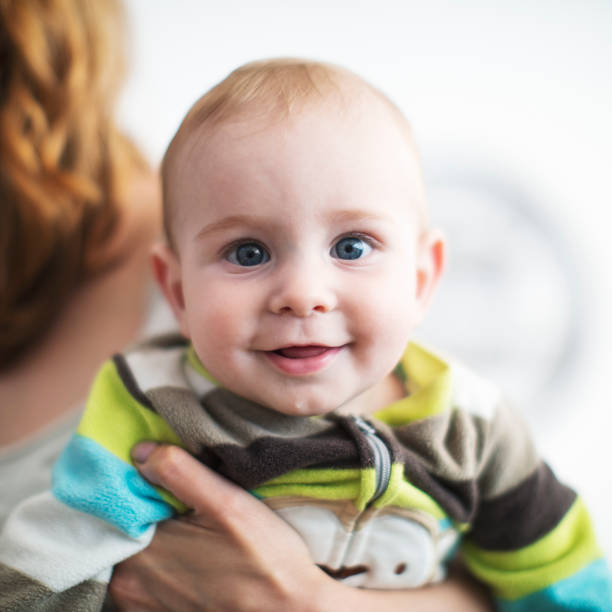 istock Little baby boy looking at camera 1384198850