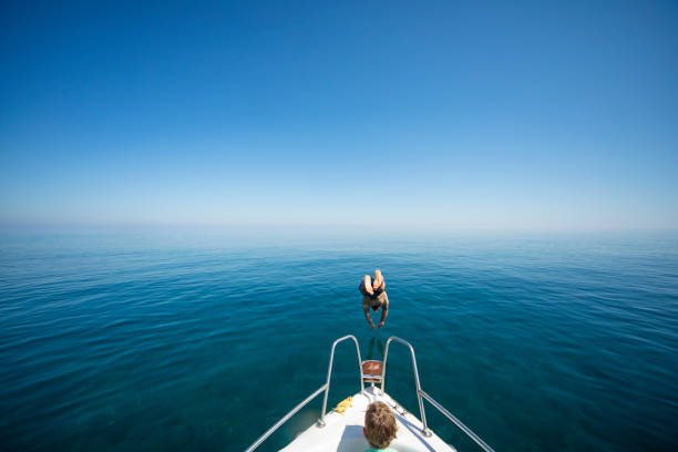 istock Father and son at speedboat 1384202903