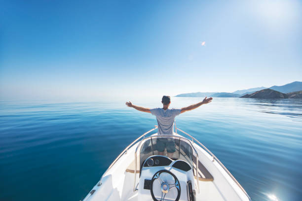 istock Young man riding on speedboat 1384202960