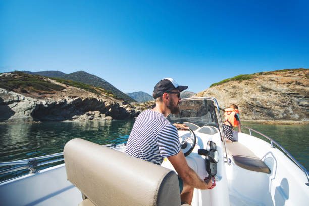 istock Father and son at speedboat 1384202963