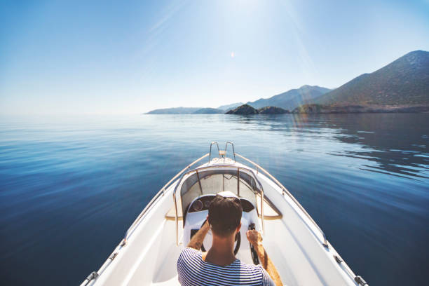 istock Young man riding on speedboat 1384202987