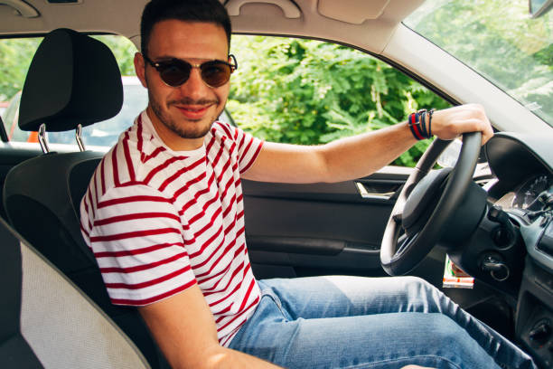 istock Smiling man parking his car 1384207610