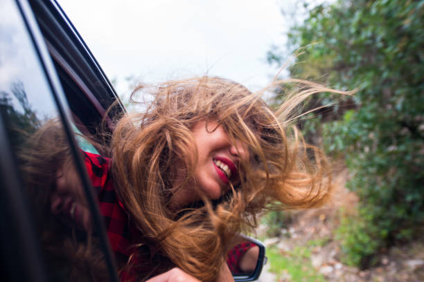 istock Girl enjoying in car drive 1384207948