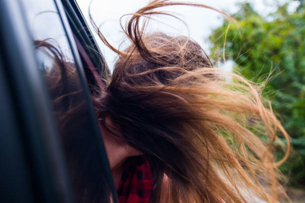 istock Girl enjoying in car drive 1384207956