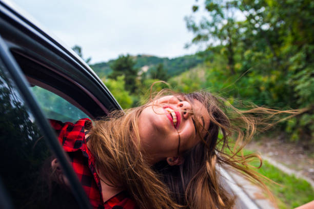 istock Woman smiling in a car 1384207958