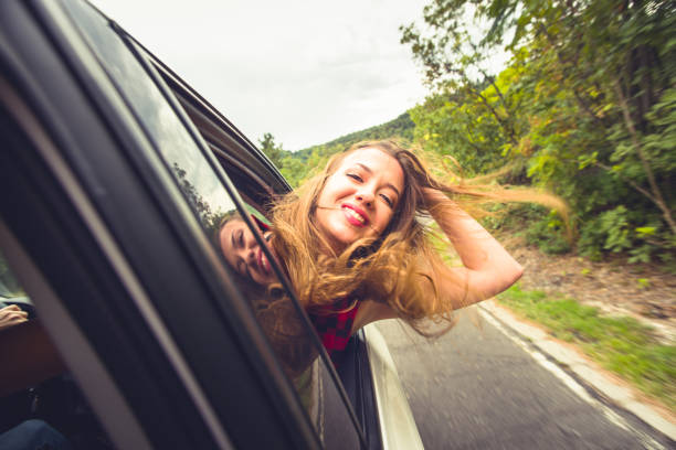 istock Woman smiling in a car 1384207960