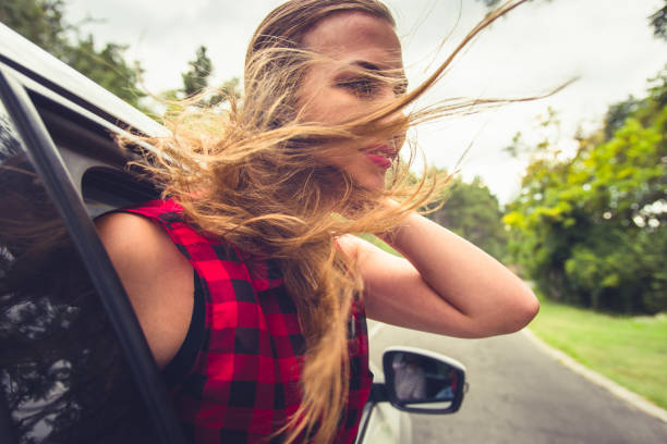 istock Woman smiling in a car 1384209646