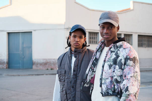 istock Two young men looking at the viewer. 1384213830