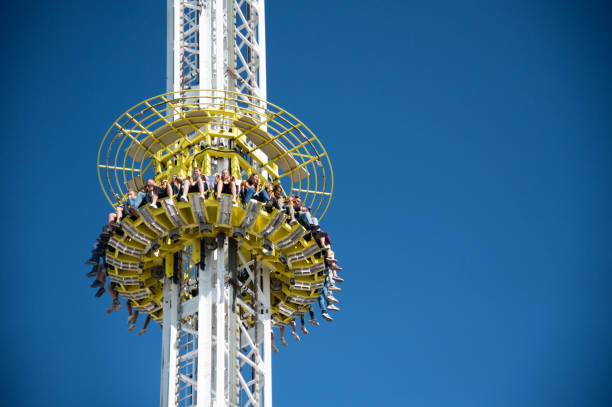 Munich, Germany - September 21, 2019: Young and old people enjoy the high tower ride at the Oktoberfest in Munich (Germany). The Oktoberfest is the biggest beer festival of the world with over 6 million visitors each year.