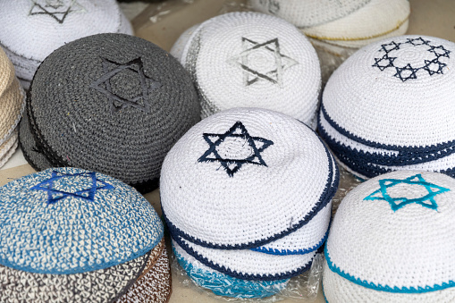 Orthodox headgear in various shades on sale on market stall