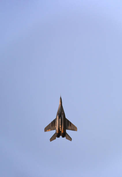 istock A military fighter jet is flying in the blue sky 1384217136