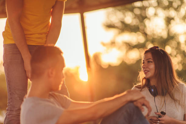 istock Friends smiling in the park 1384217356