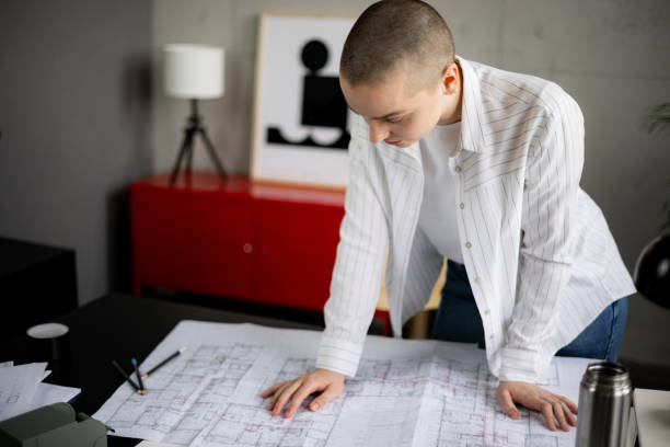 istock Professional Caucasian female architect working in her office 1384217446