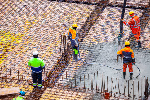 istock Concrete pouring on the construction site. 1384217598