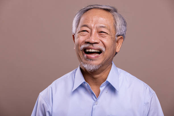 istock Senior man portrait. Laughing. 1384219029