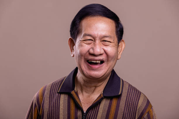 istock Senior man portrait. Laughing. 1384219035