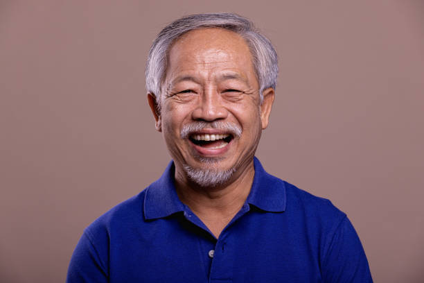 istock Senior man portrait. Laughing. 1384219102