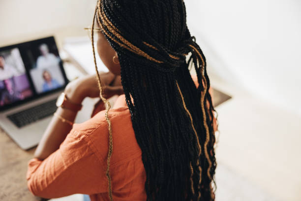 istock Creative young woman attending a virtual meeting 1384219383