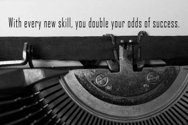 motivational and inspirational quote typed on an old typewriter. - typewriter sepia toned old nostalgia imagens e fotografias de stock