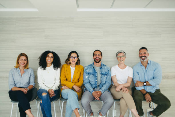 istock Successful job applicants sitting in a row 1384224505