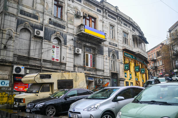 TBILISI, GEORGIA - MARCH 11, 2021. Ukrainian flag waving hang on private apartment balcony in support of Ukraine. stock photo