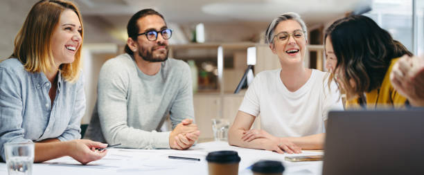 istock Happy design professionals having a meeting in an office 1384224578
