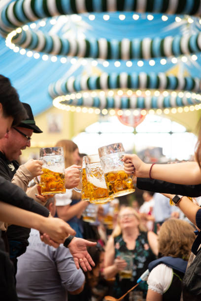 tenda della birra, octoberfest a monaco di baviera, germania - german culture oktoberfest dancing lederhosen foto e immagini stock