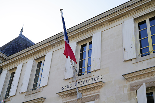 sous Préfecture means sub-prefecture in french city with france blue white red flag in town center on outdoor building wall