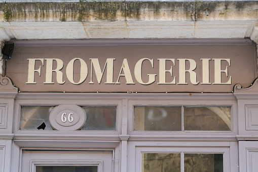 Fromagerie shop text sign french means cheese store on boutique wall facade
