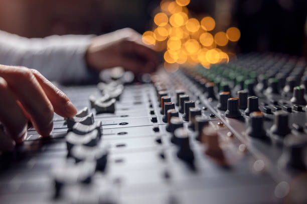 sound recording studio mixing desk with engineer or music producer - human finger sound mixer music producer imagens e fotografias de stock