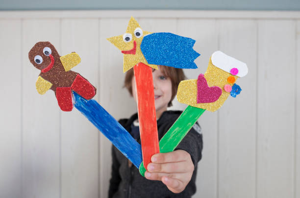istock Child boy showing her Christmas page markers 1384240430