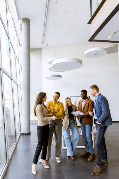 istock Creative team working together in the modern office 1384242724