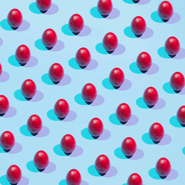 istock Pattern of colored eggs on a pastel blue background. The concept of minimal food.Easter 1384243825