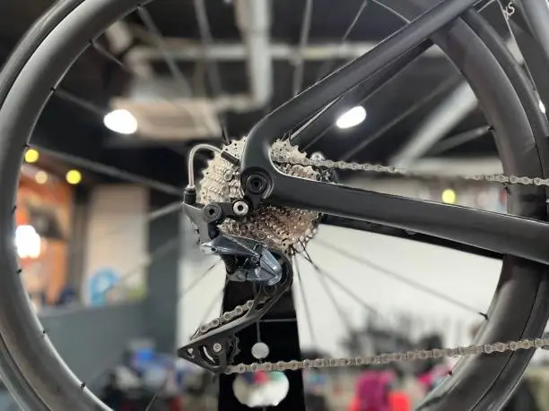 Close up view of a bicycle wheel in a bicycle shop or workshop. Transport concept.