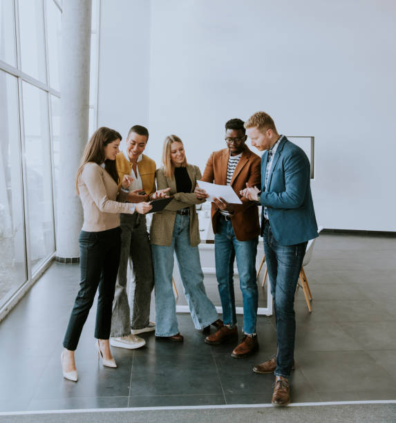 istock Creative team working together in the modern office 1384243919