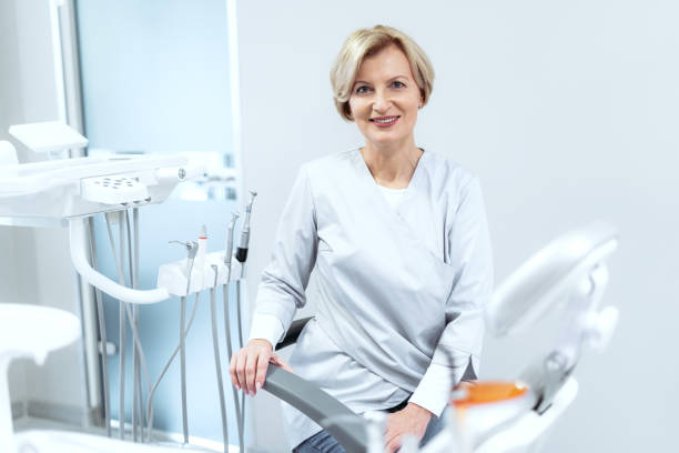 istock Experienced dentist looking at camera when sitting in her cabinet 1384246101