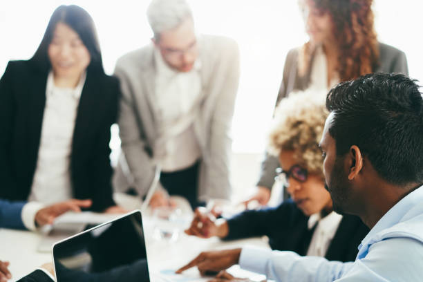 istock Business young people working inside company office - Startup and smart projects concept - Focus on indian man ear 1384248006