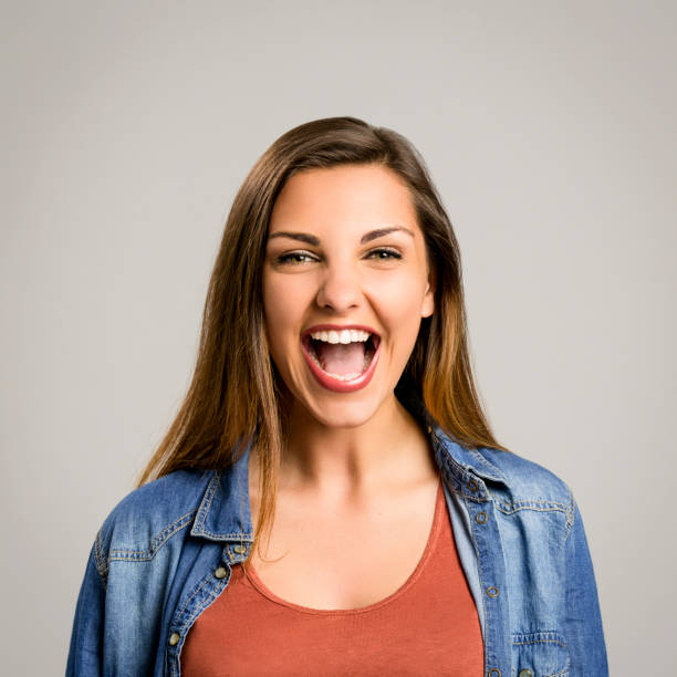 istock Happy woman laughing 1384251751