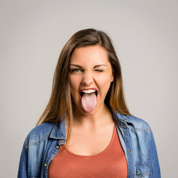 istock Woman with tongue out 1384251753