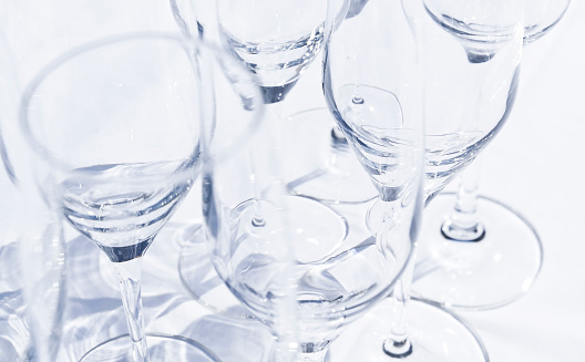 Close-up of wine glasses on a white background