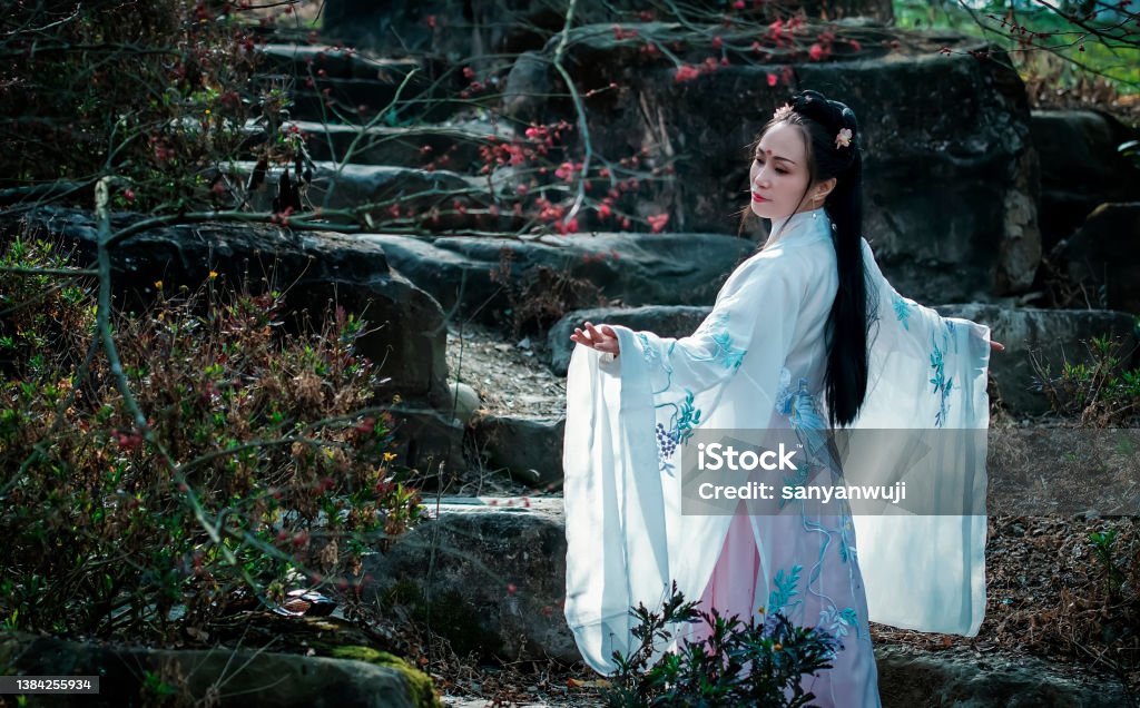 A woman in the woods A woman in a Chinese costume is in the woods 50-54 Years Stock Photo