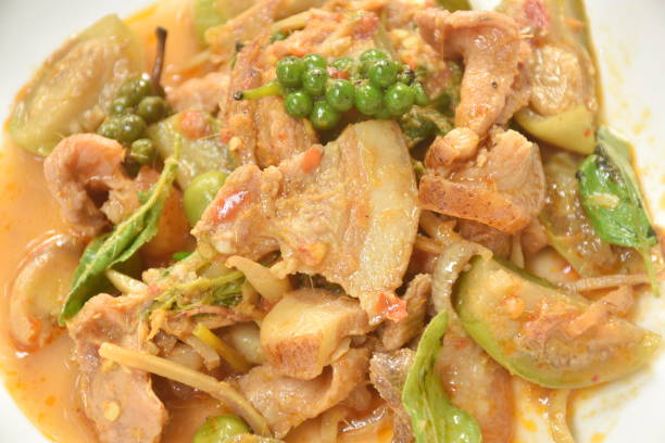 istock stir fried spicy wild boar and finger root with red curry 1384256559