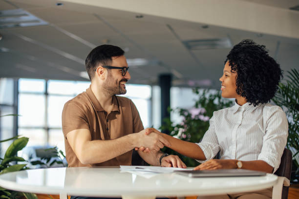 istock Business people, shaking hands, just finished a meeting. 1384256756
