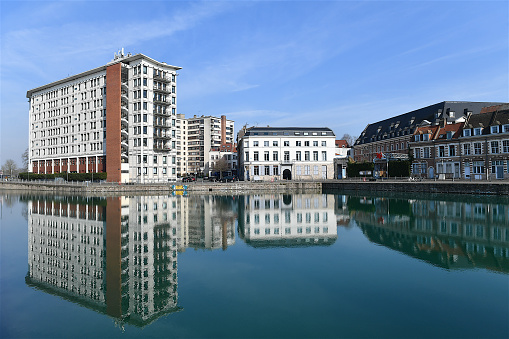 Lille, France-03 03 2022: Reflection of buildings in a canal of Lille, France.